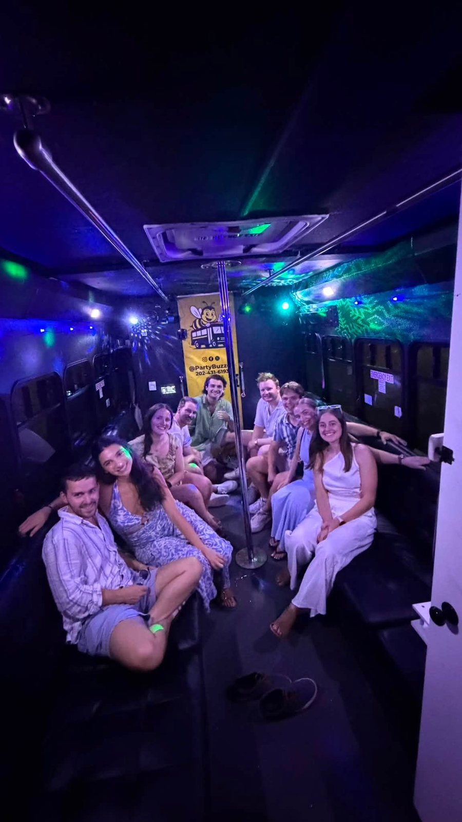 Friends enjoying an evening ride inside the Party Buzzed party bus
