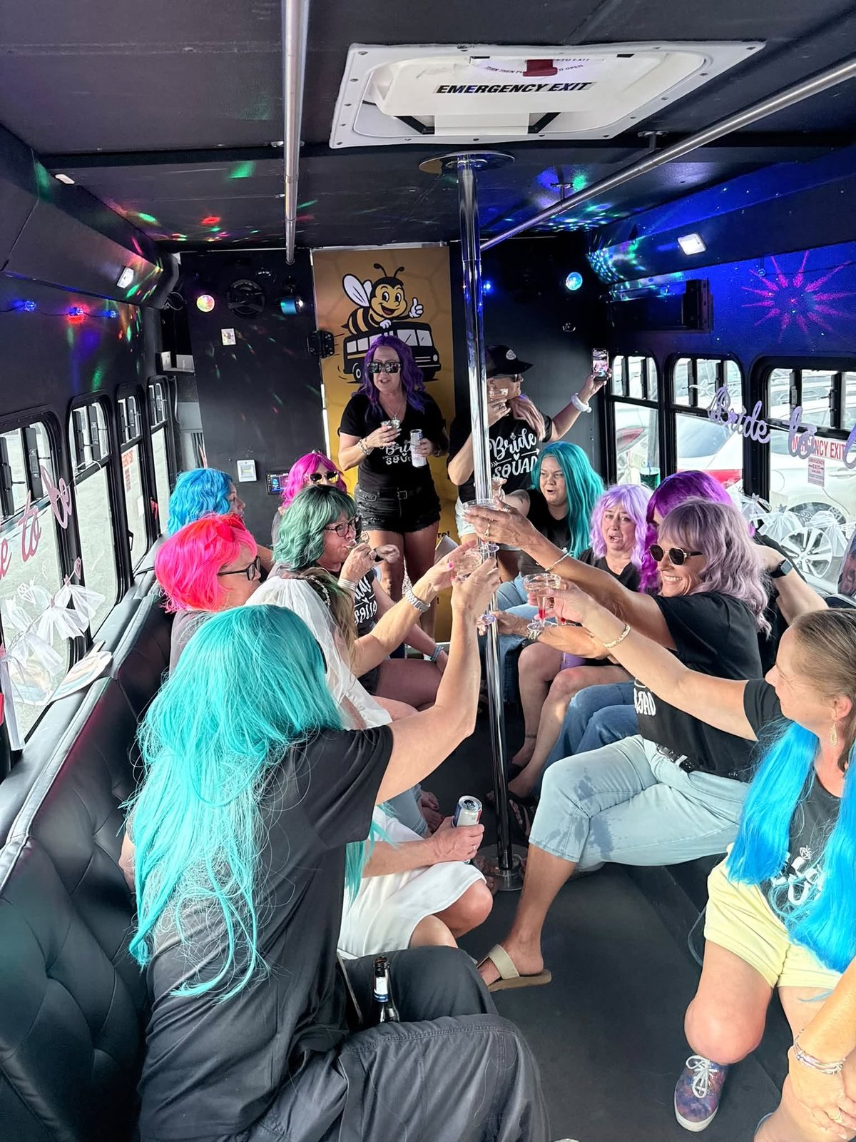 Bride squad celebrating together inside the Party Buzzed party bus