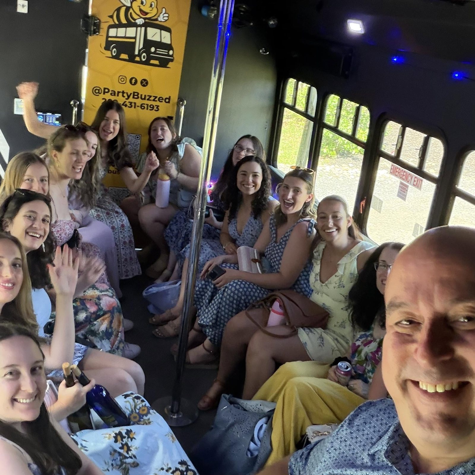 Celebration group riding together inside the Party Buzzed party bus